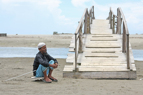 beggar on beach